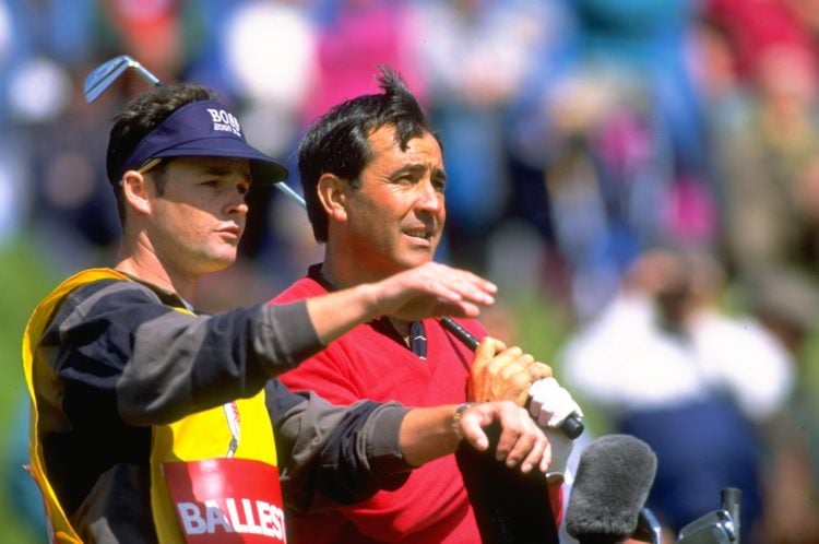 1994:  Seve Ballesteros of Spain discusses his next shot with his caddie Billy Foster during the Benson and Hedges International Open at St. Mellio...