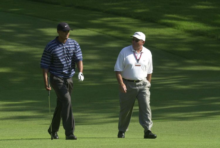 12 Jun 2001:  Tiger Woods walks down the fairway with coach Butch Harmon during a practice round in preparation for the 101st US Open at Southern H...