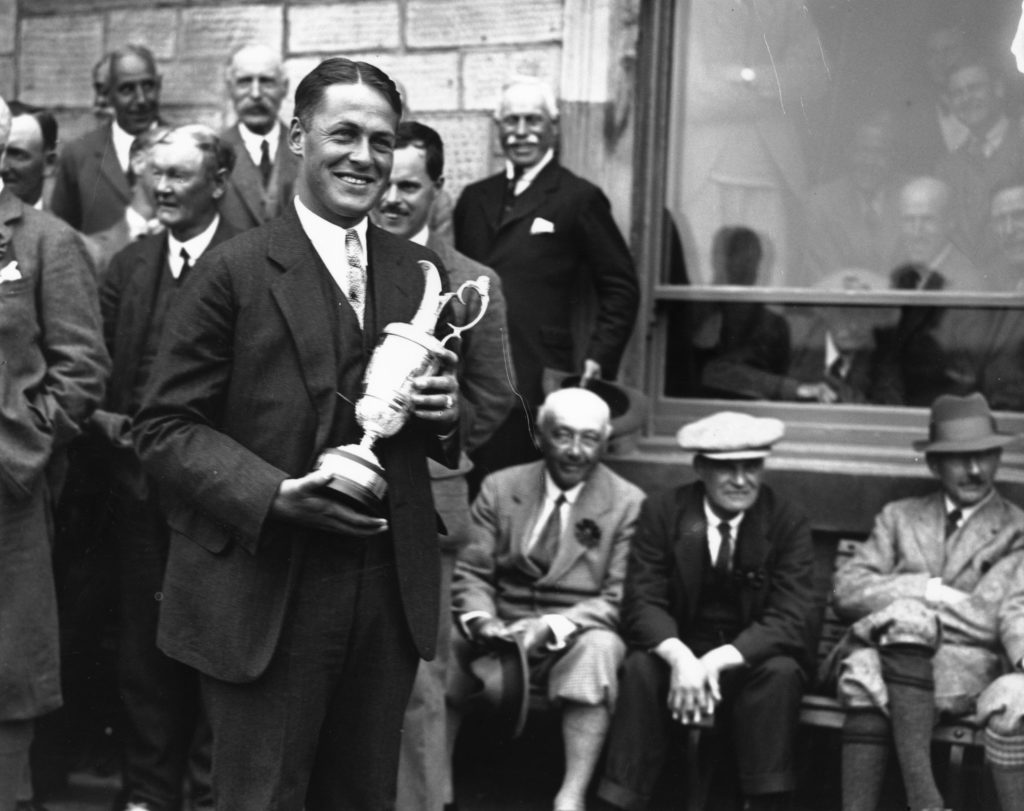 Bobby Jones holding the Claret Jug after winning The Open Championship at St Andrews in 1927