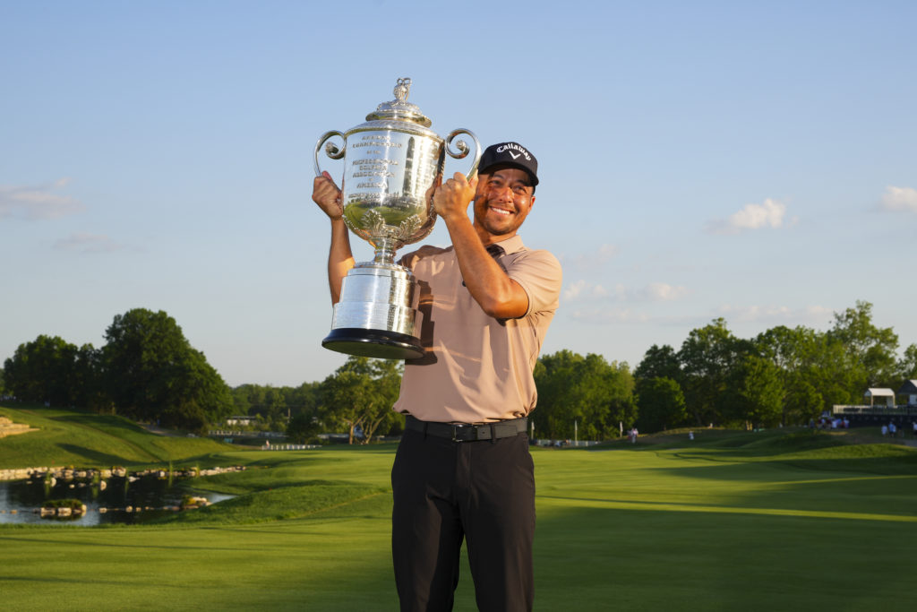 Xander Schauffele lifts the PGA Championship trophy
