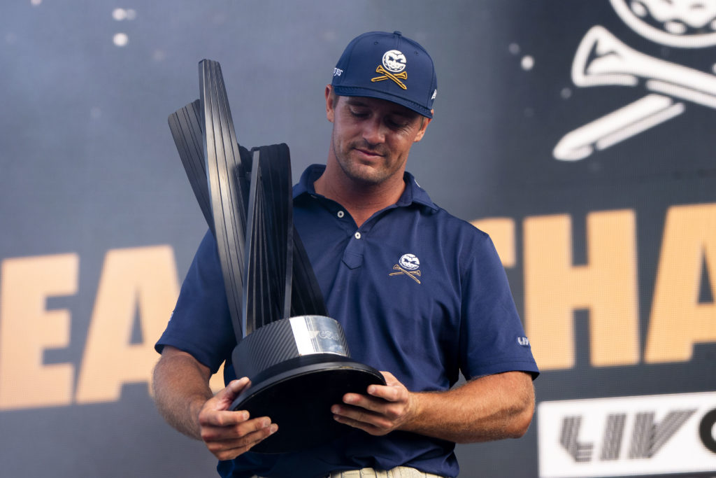 Bryson DeChambeau holds the team title trophy for winning LIV Golf Chicago