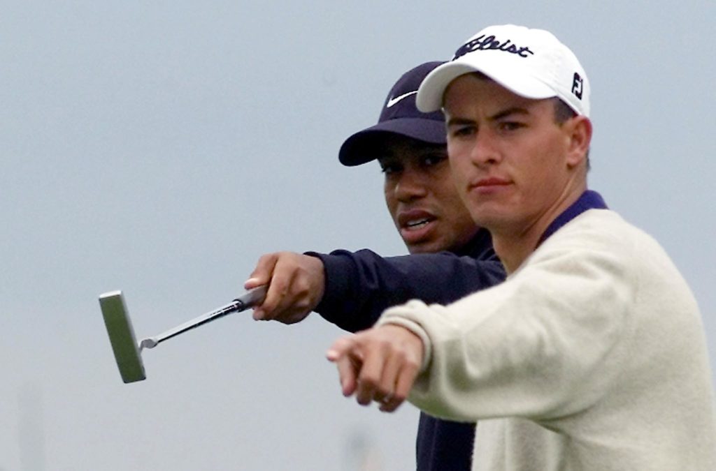 US golfer Tiger Woods (L) gives instructions to Au