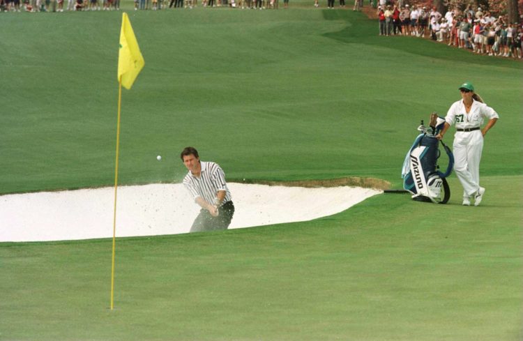 14 Apr 1996:  Nick Faldo of England plays out of the bunker and on to the second green during the final round of the 1996 Masters at Augusta Nation...