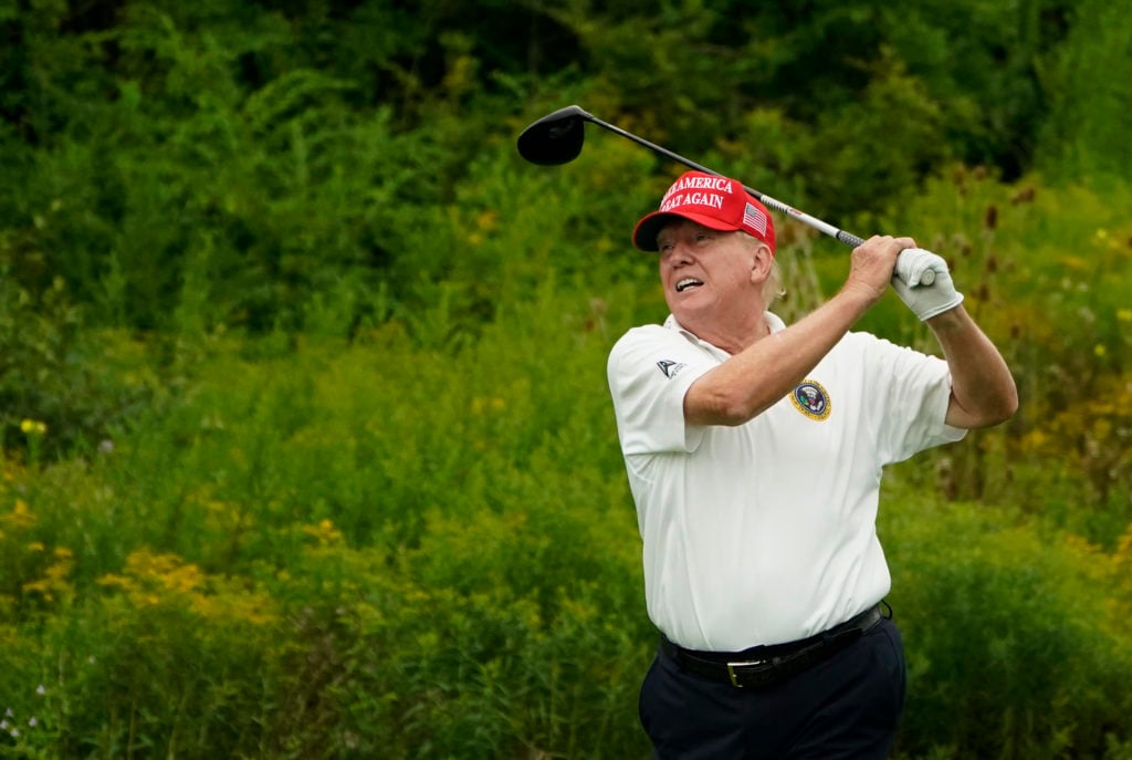 Former US President and 2024 Presidential hopeful Donald Trump plays golf during the Official Pro-Am Tournament ahead of the LIV Golf Invitational Series