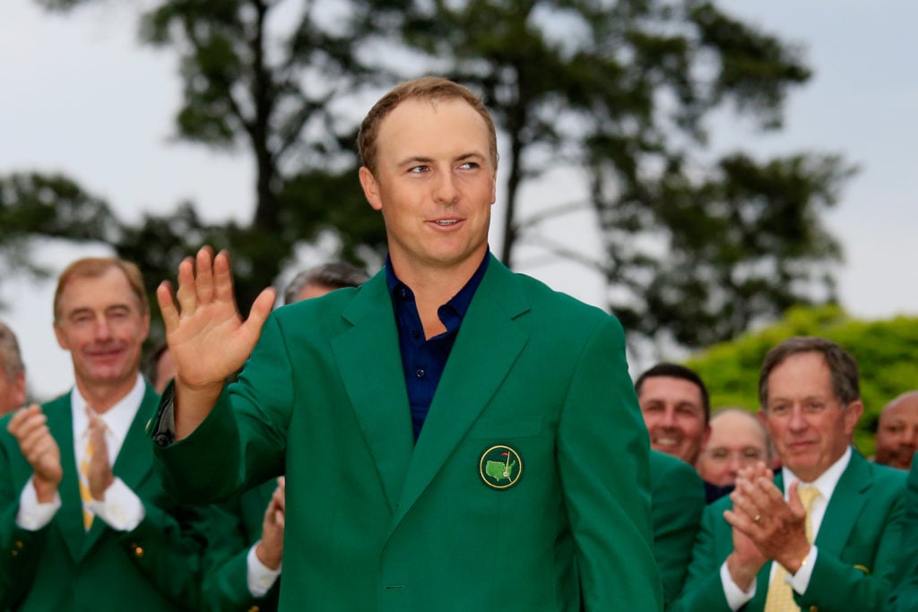 Jordan Spieth poses with the green jacket after winning the 2015 Masters Tournament