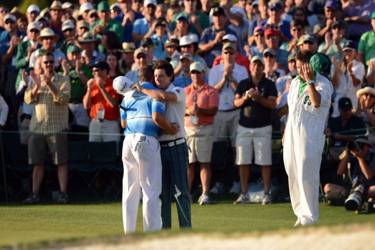 Sergio Garcia of Spain, left, and Rory McIlroy of Northern Ireland hug each other on No. 18 during Saturday's third round at the 2012 Masters Tourn...