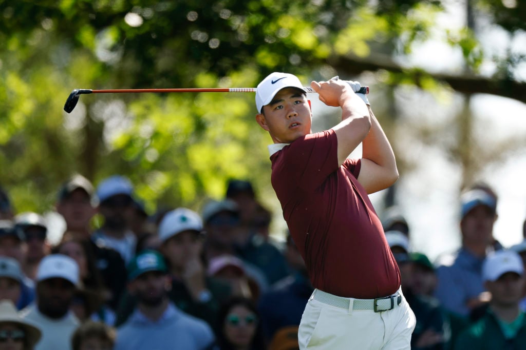 Tom Kim tees off from the fourth hole during the third round of The Masters
