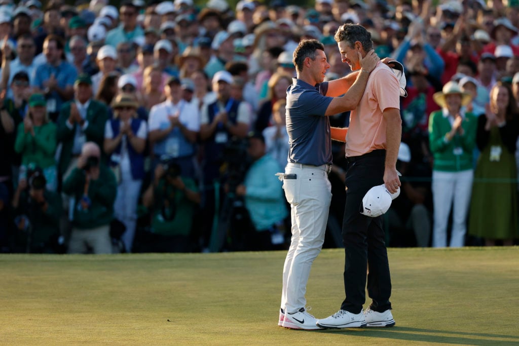 Rory McIlroy of Northern Ireland shakes hands with Justin Rose of England after the first playoff hole during the final round of the 2025 Masters Tournament at Augusta National