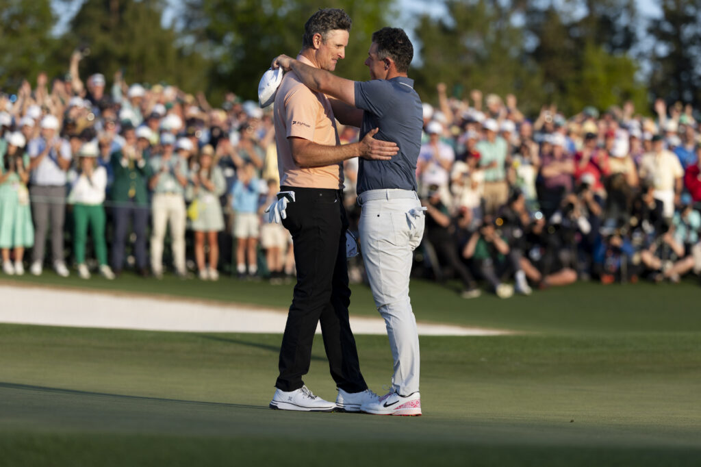 Justin Rose and Rory McIlroy embrace at The 2025 Masters
