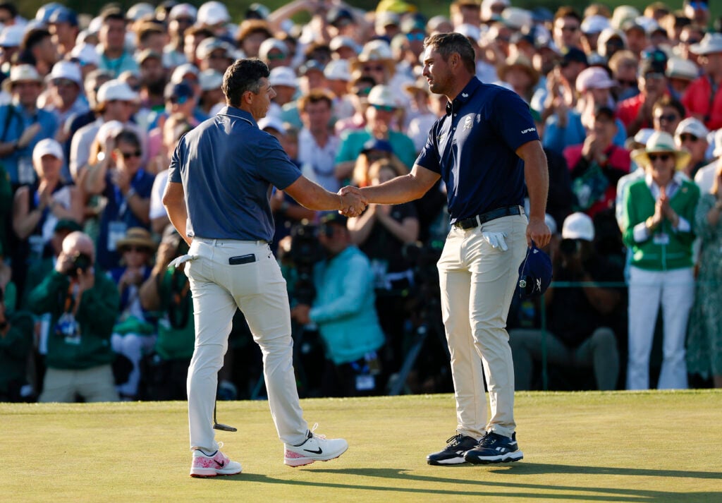 Bryson DeChambeau shakes hands with Rory McIlroy after the last round of The Masters