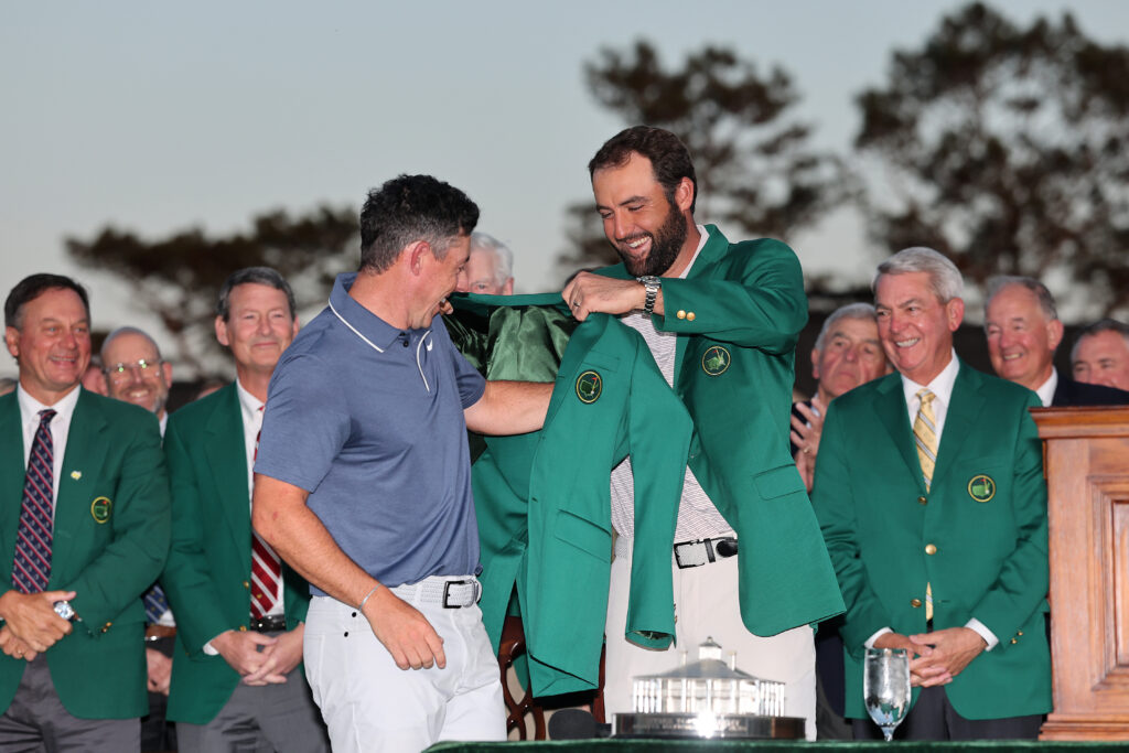 Rory McIlroy puts on the green jacket after winning The Masters