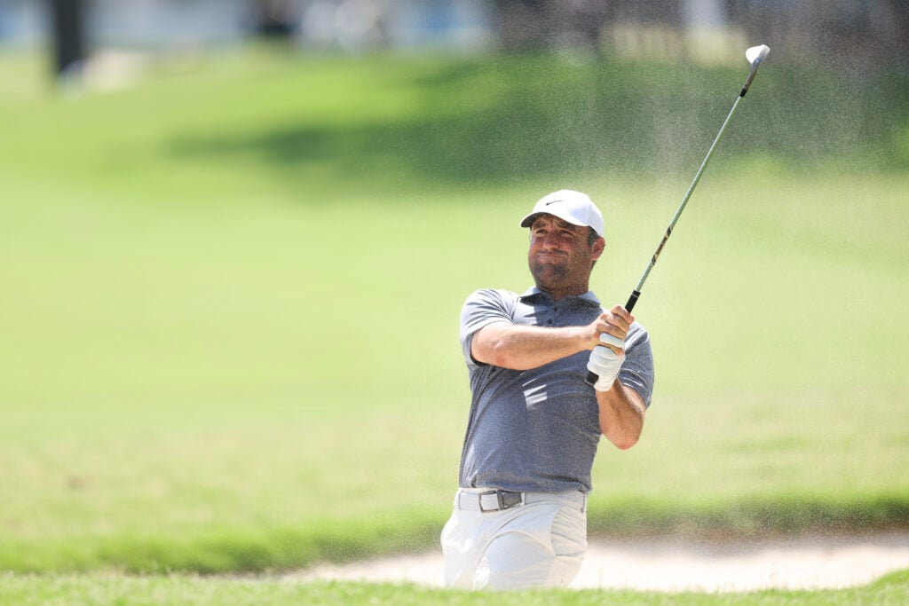 Scottie Scheffler playing out of a bunker at Charles Schwab Challenge