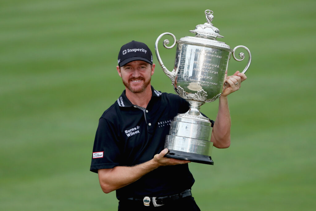 Jimmy Walker holding the 2016 PGA Championship trophy