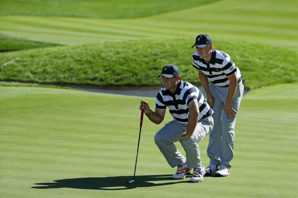 Patrick Reed and Jordan Spieth line up a putt at the 2017 Presidents Cup