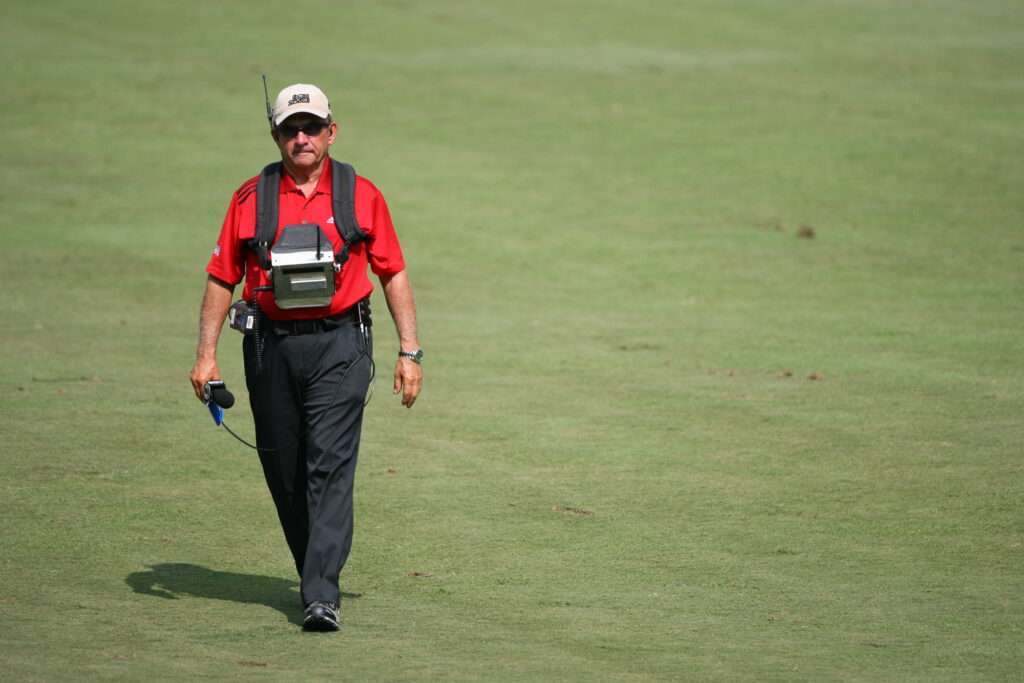 Peter Kostis walks a fairway during the final round of the Wyndham Championship in 2010