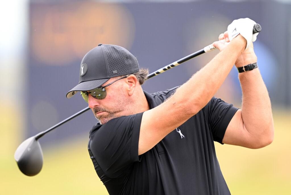 Phil Mickleson of The United States tees off the driving range during a practice round prior to The 150th Open
