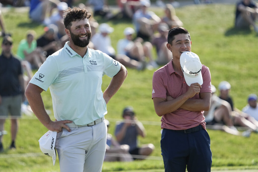 Jon Rahm and Collin Morikawa on the 18th green at the 2023 Memorial Tournament