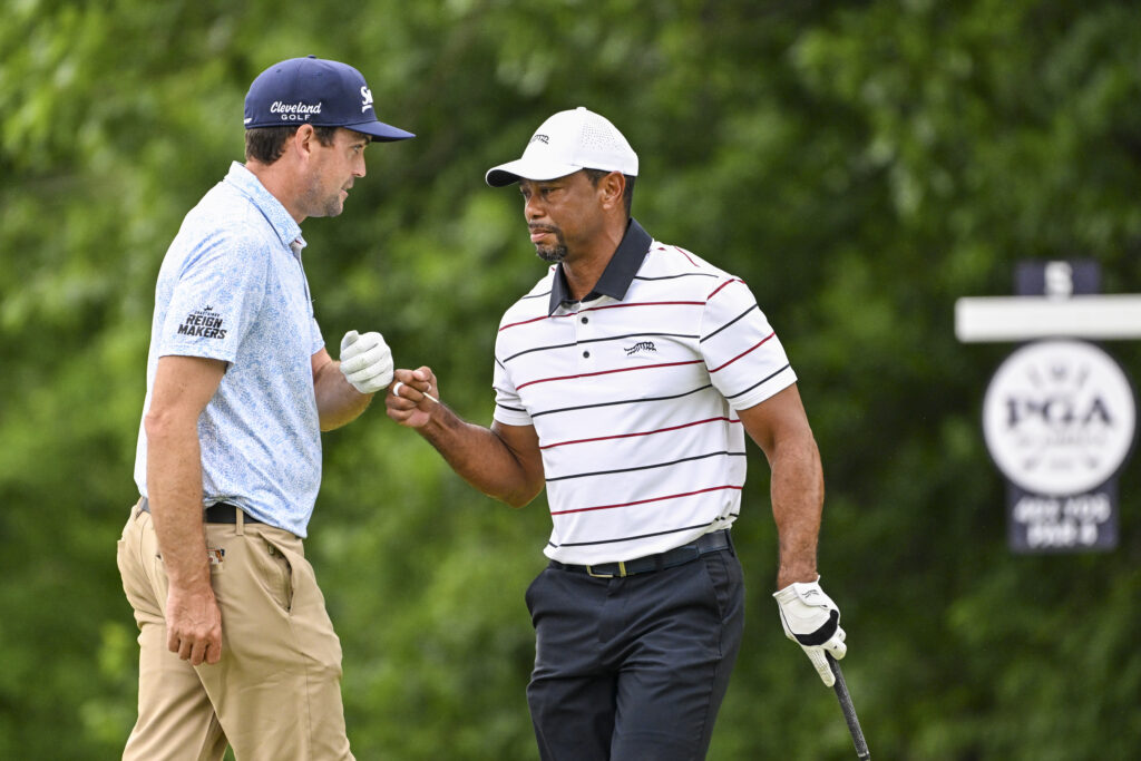 Keegan Bradley fist-bumps Tigers Woods during the second round of the PGA Championship at Valhalla Golf Club in 2024