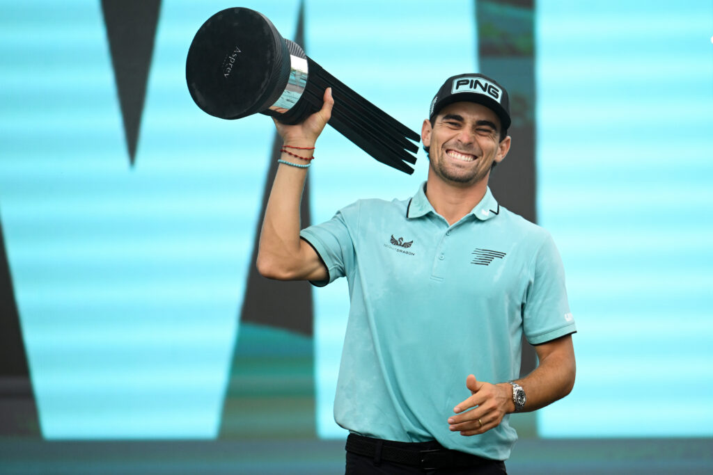 Joaquin Niemann celebrates with LIV Golf Virginia trophy