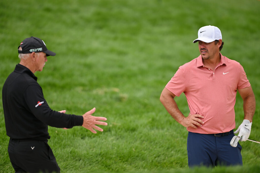Brooks Koepka talking with Pete Cowen in practice ahead of the 2025 US Open