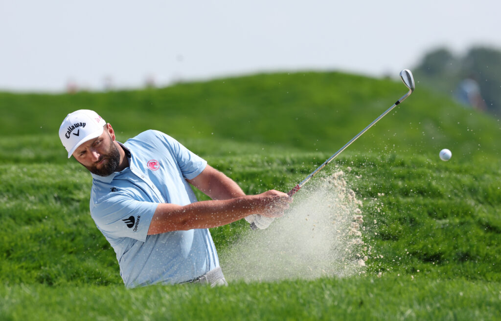 Jon Rahm plays bunker shot in US Open practice