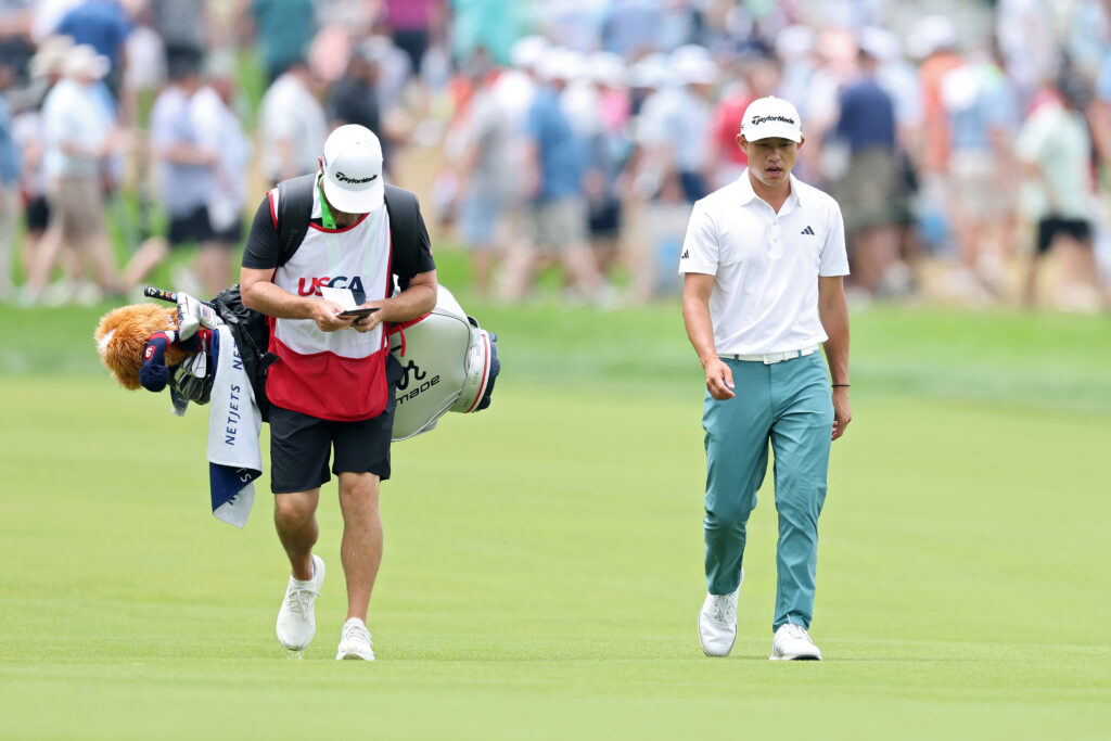 Collin Morikawa walks down the fairway during the third round of the US Open