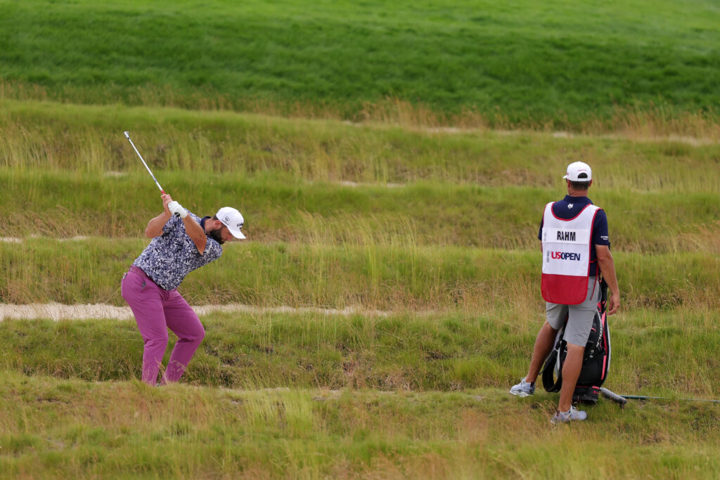 Jon Rahm plays from the bunker on the fourth hole during the final round of the 2025 US Open