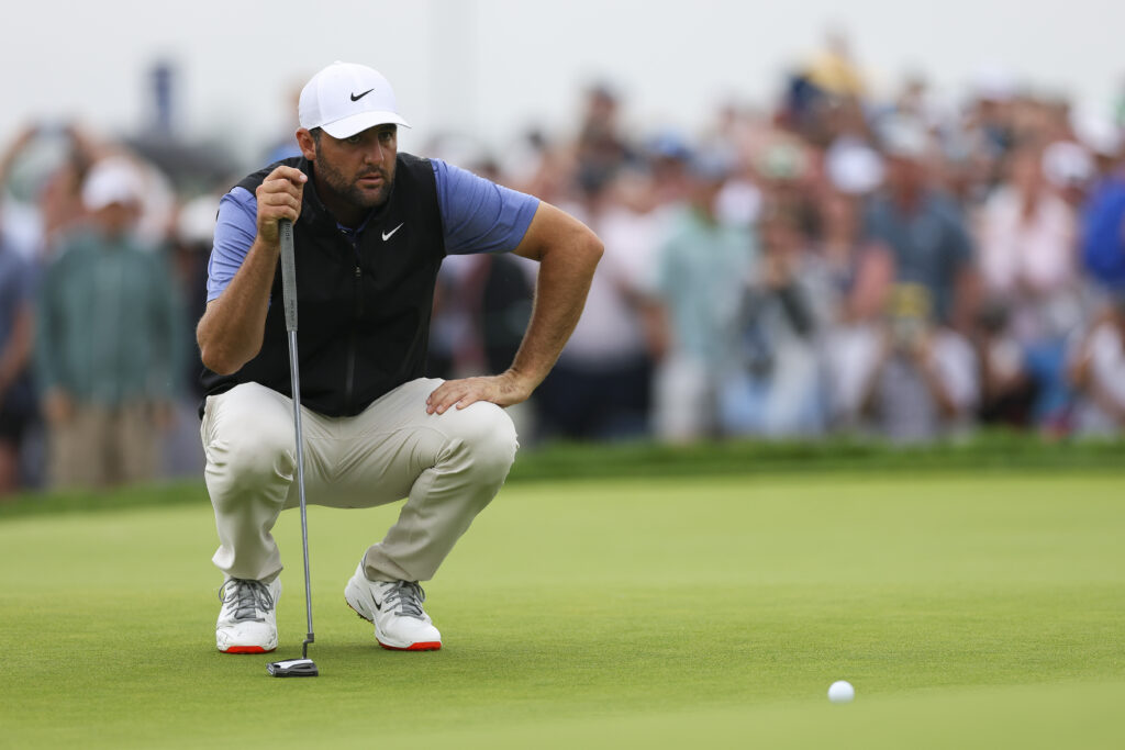 Scottie Scheffler lines up a putt in the final round of the US Open