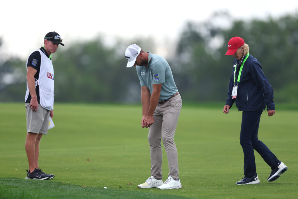 Sam Burns looks to receive a drop on the 15th hole during the final round of the 2025 US Open