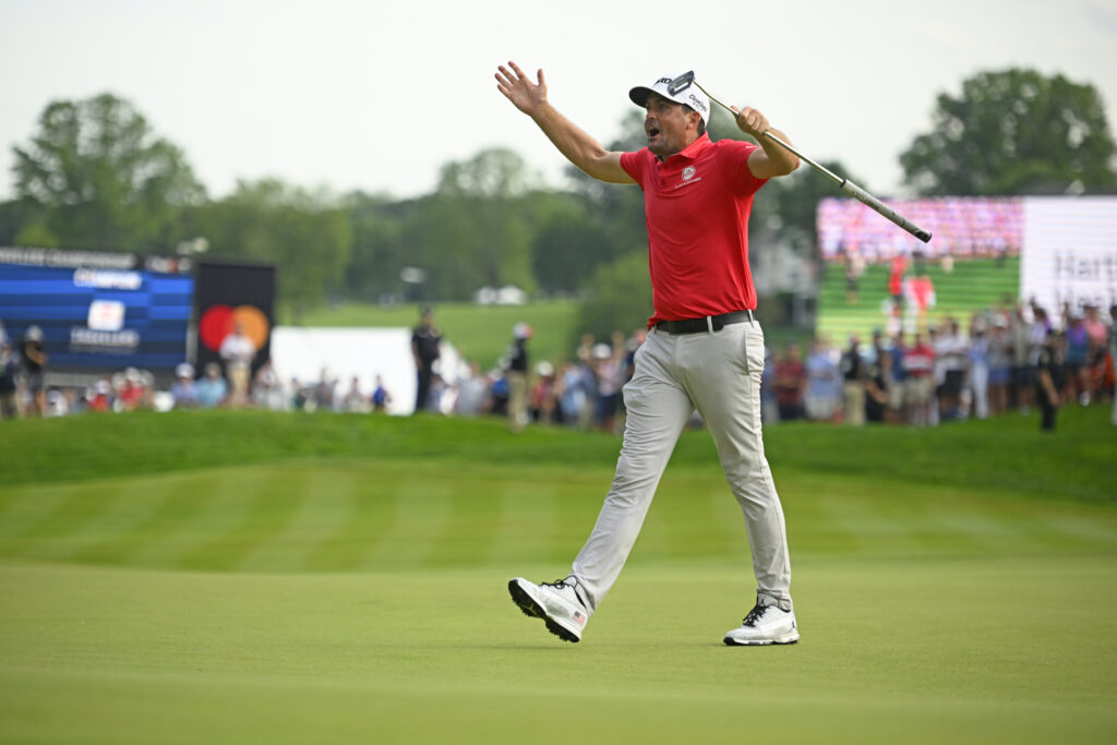 Keegan Bradley celebrates on the 18th green after winning the Travelers Championship