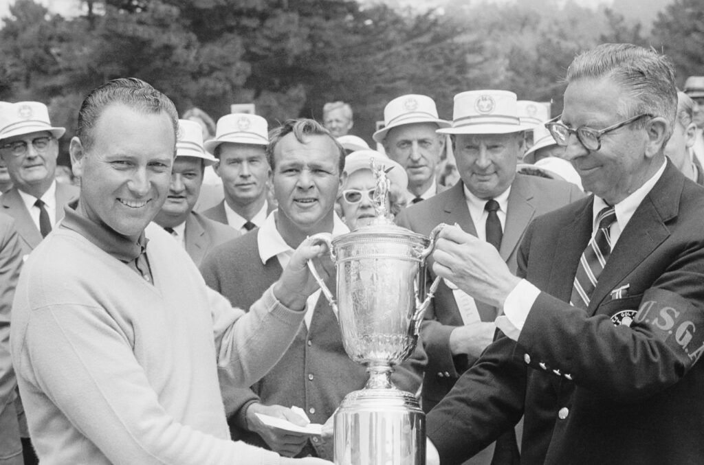 Billy Casper holding the US Open trophy after beating Arnold Palmer in a playoff