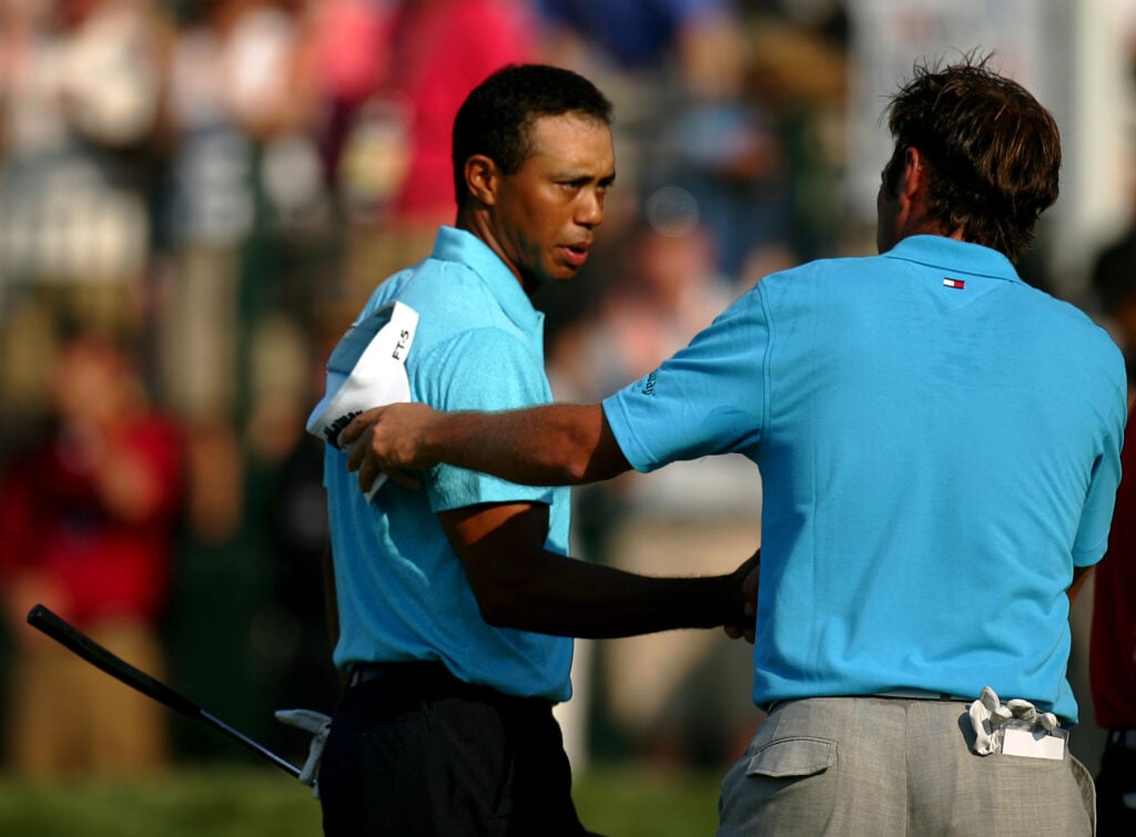 Tiger Woods and Nick Dougherty shake hands after the third round at the 2007 US Open