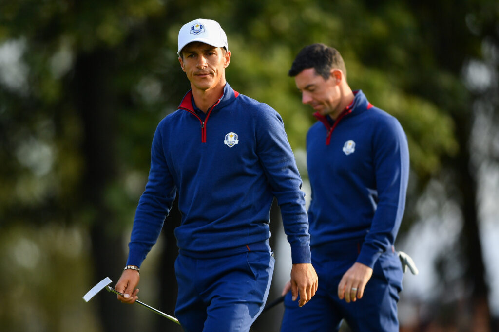 Thorbjorn Olesen and Rory McIlroy look disappointed during their match in the first session of the 2018 Ryder Cup