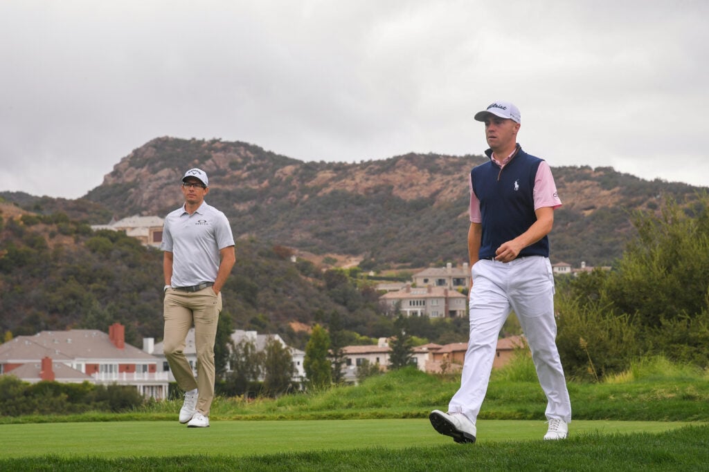 Dylan Frittelli walking alongside Justin Thomas during the ZOZO Championship at Sherwood Oaks in 2020