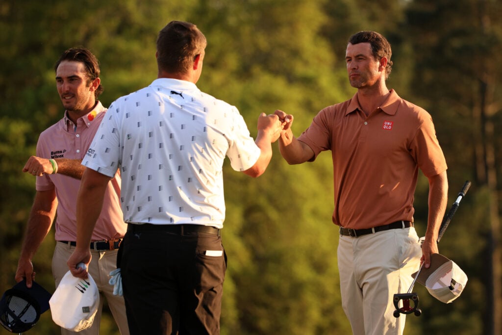 Bryson DeChambeau shakes hands with Adam Scott at The Masters in 2021
