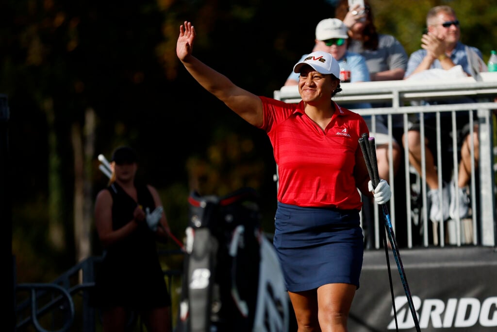 Phillis Meti of New Zealand waves to the crowd before hitting during the final round of the World Long Drive Championship