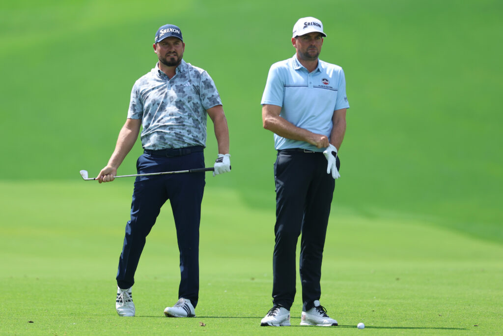 Andrew Novak stands alongside Keegan Bradley on the 18th hole at Quail Hollow during the opening round of the 2025 PGA Championship