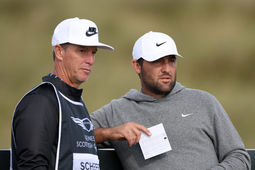 Scottie Scheffler alongside his caddie Ted Scott during a practice round ahead of the Genesis Scottish Open