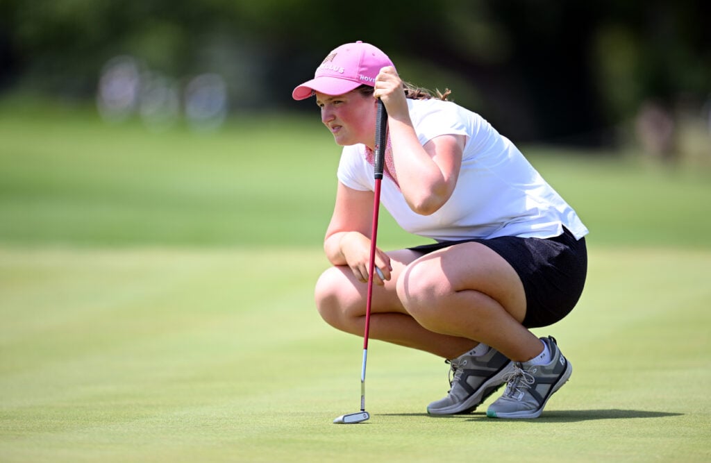 Lottie Woad lines up a putt during the final round of the Evian Championship