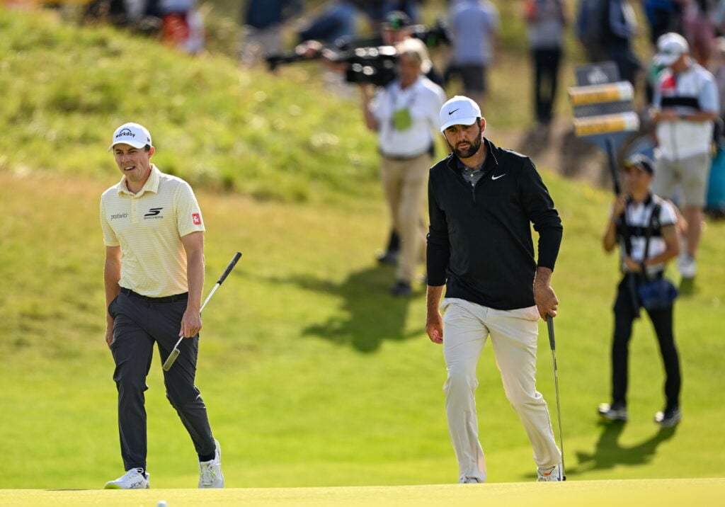 Matt Fitzpatrick walk side by side during the third round of The Open Championship at Royal Portrush