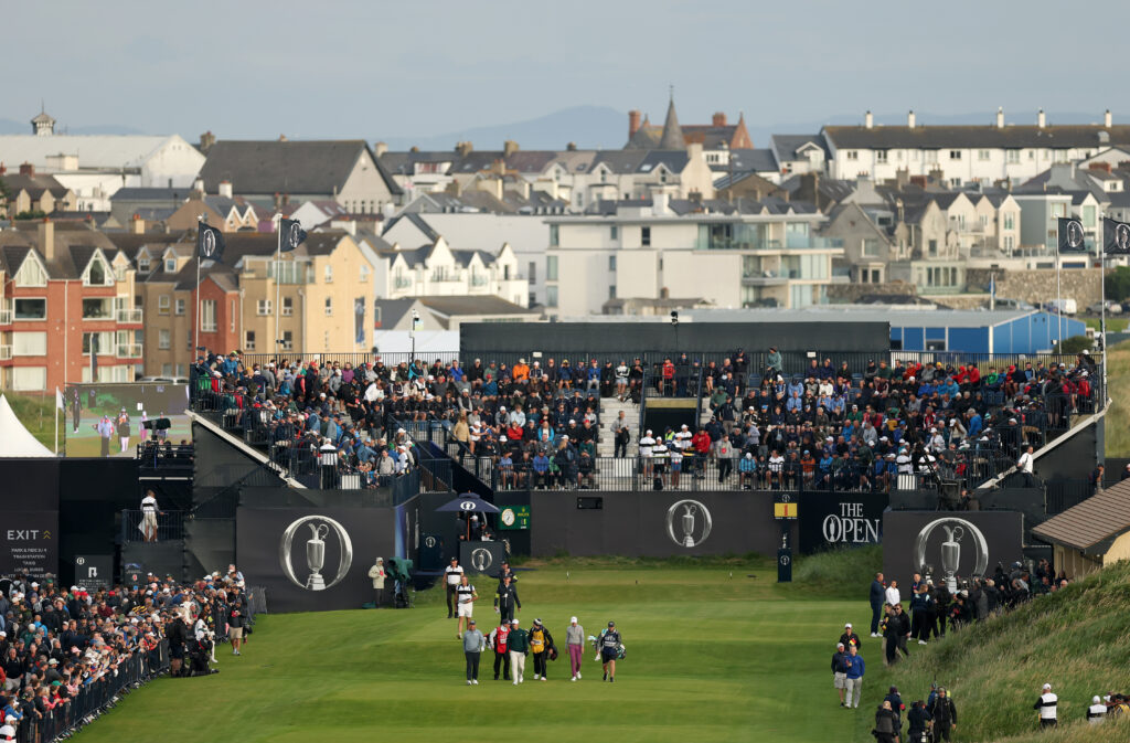 Padraig Harrington, Tom Mckibbin and Nicolai Hojgaard walk from the first tee at The Open Championship