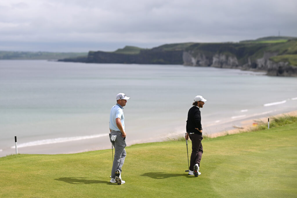 Justin Thomas and Tommy Fleetwood look across the fifth green during The Open Championship