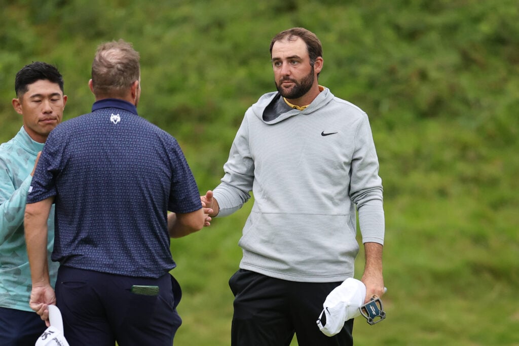 Scottie Scheffler standing alongside Shane Lowry during The Open Championship at Royal Portrush