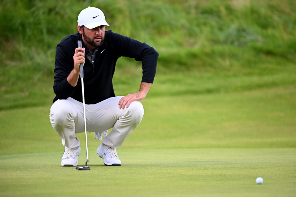 Scottie Scheffler lines up a putt during the third round of The Open
