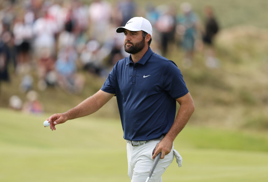 Scottie Scheffler acknowledges the crowd on the eighth green during day four of The Open Championship