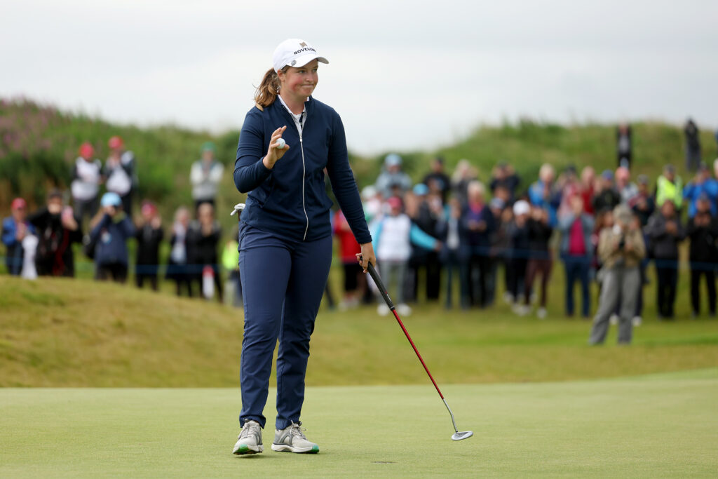 Lottie Woad acknowledges the crowd after holing the putt to win the Women's Scottish Open at Dundonald Links