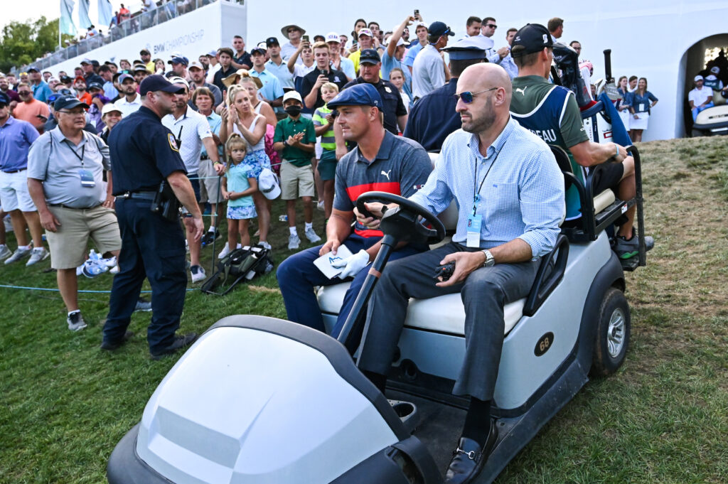Bryson DeChambeau rides to the tee ahead of the playoff at the 2021 BMW Championship