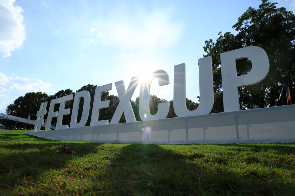 FedEx Cup signage is displayed on the ninth hole during the third round of the TOUR Championship at East Lake Golf Club