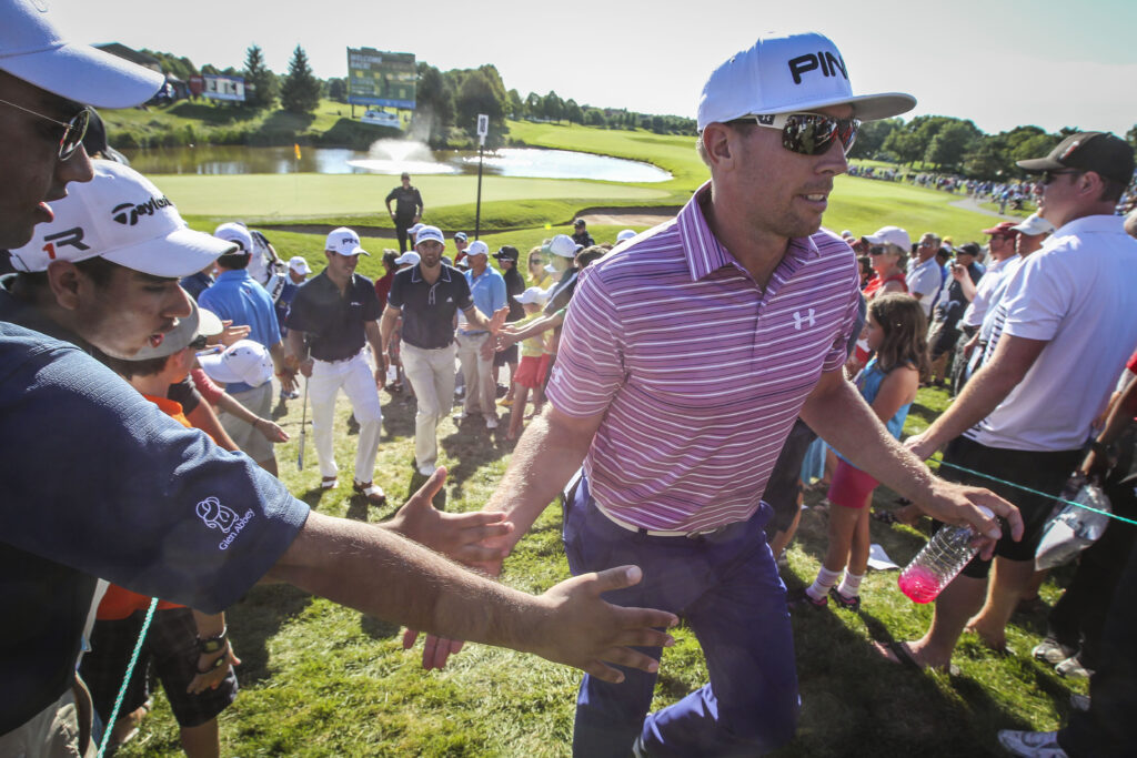 Hunter Mahan embraces the crowd after his second round at the 2013 Canadian Open