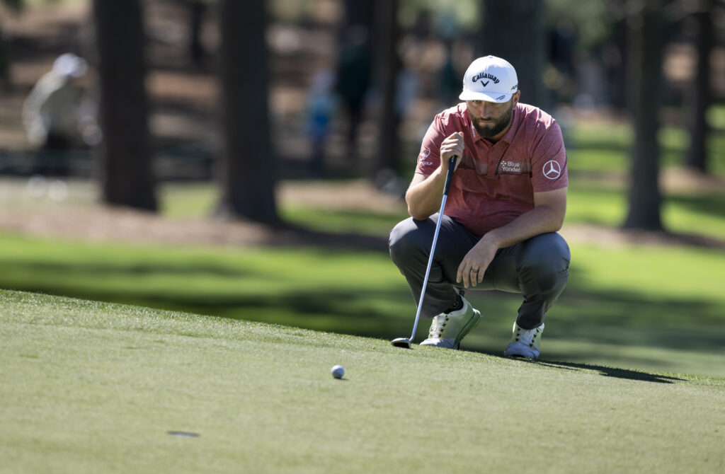 Jon Rahm lines up a putt during the final round of the 2023 Masters